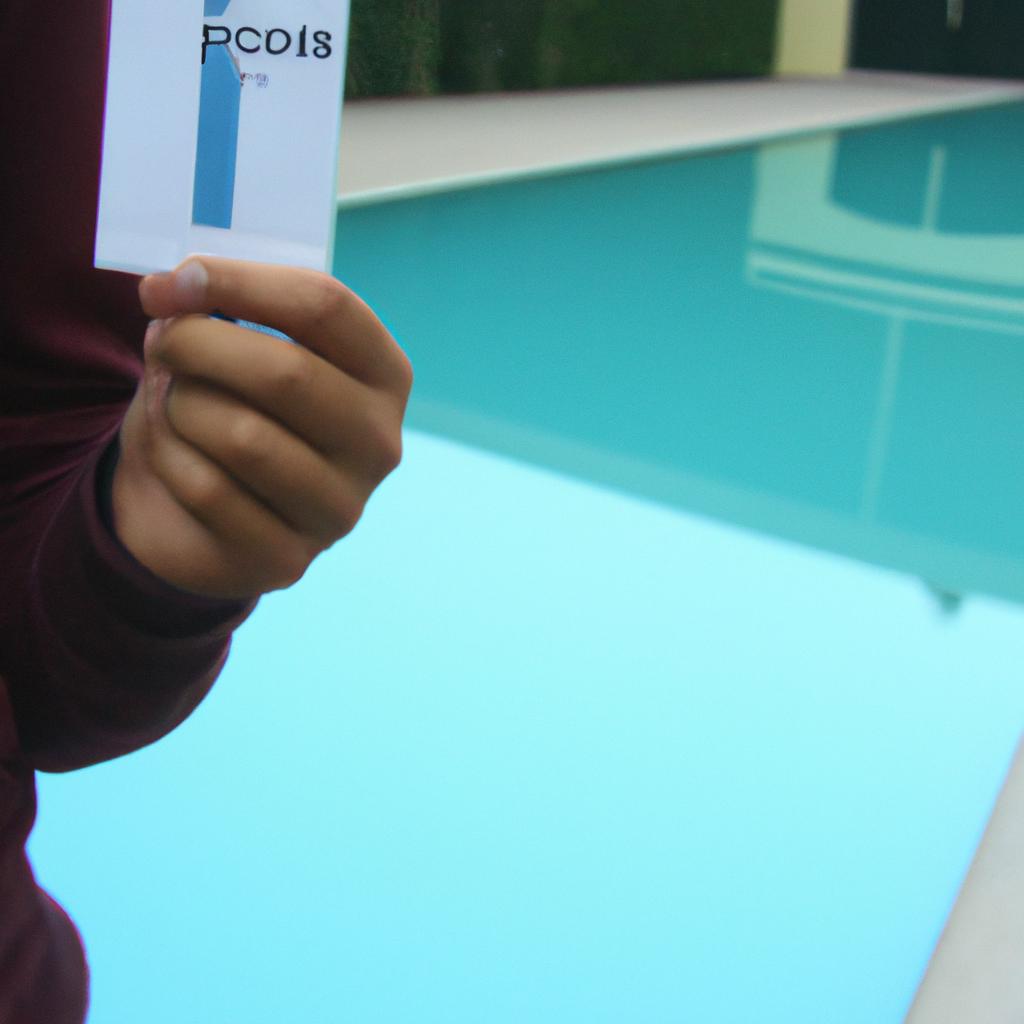 Person holding pool membership brochure